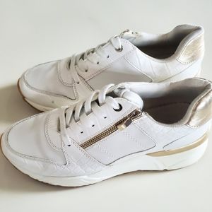 White with gold trim and side zipper runners